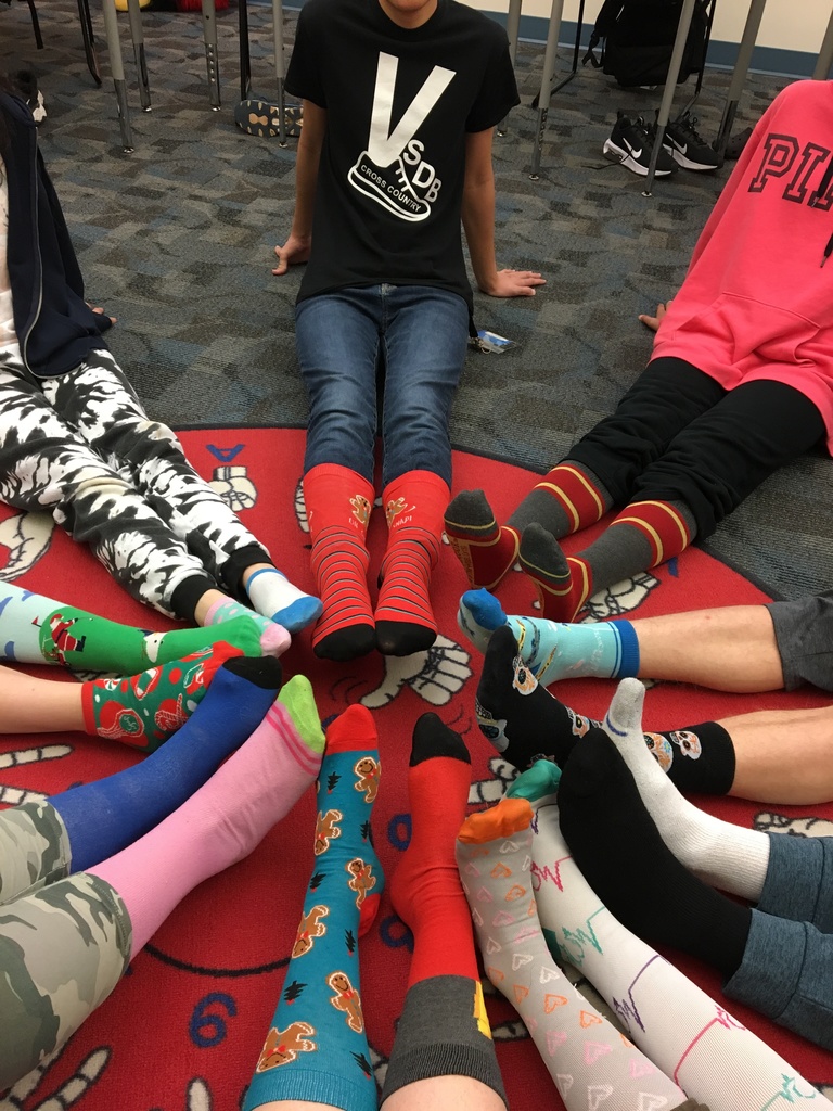 9 sets of feet with silly socks