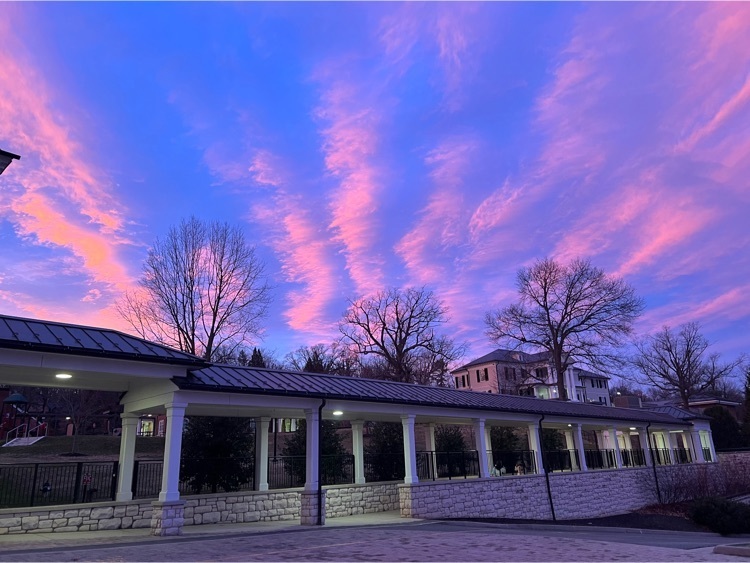 vsdb walkway between buildings with a blue and pink sunset above it 