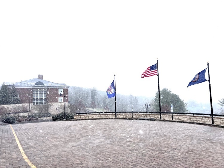 VSDB campus and flags with a light dusting of snow and snow falling