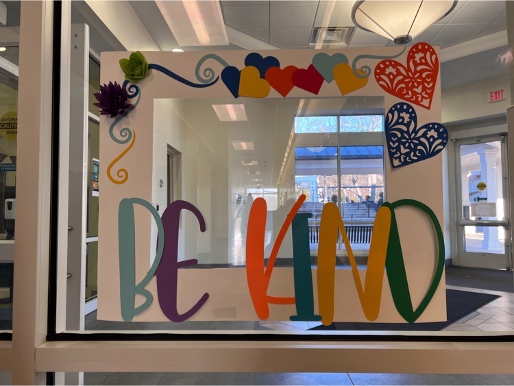photo frame decorated with many bright colors and text reading “be kind” 