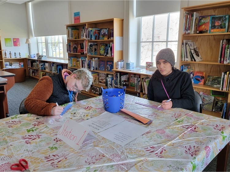 two female students coloring 