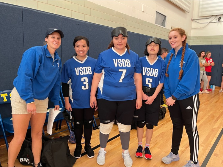 girls Goalball team and two coaches 
