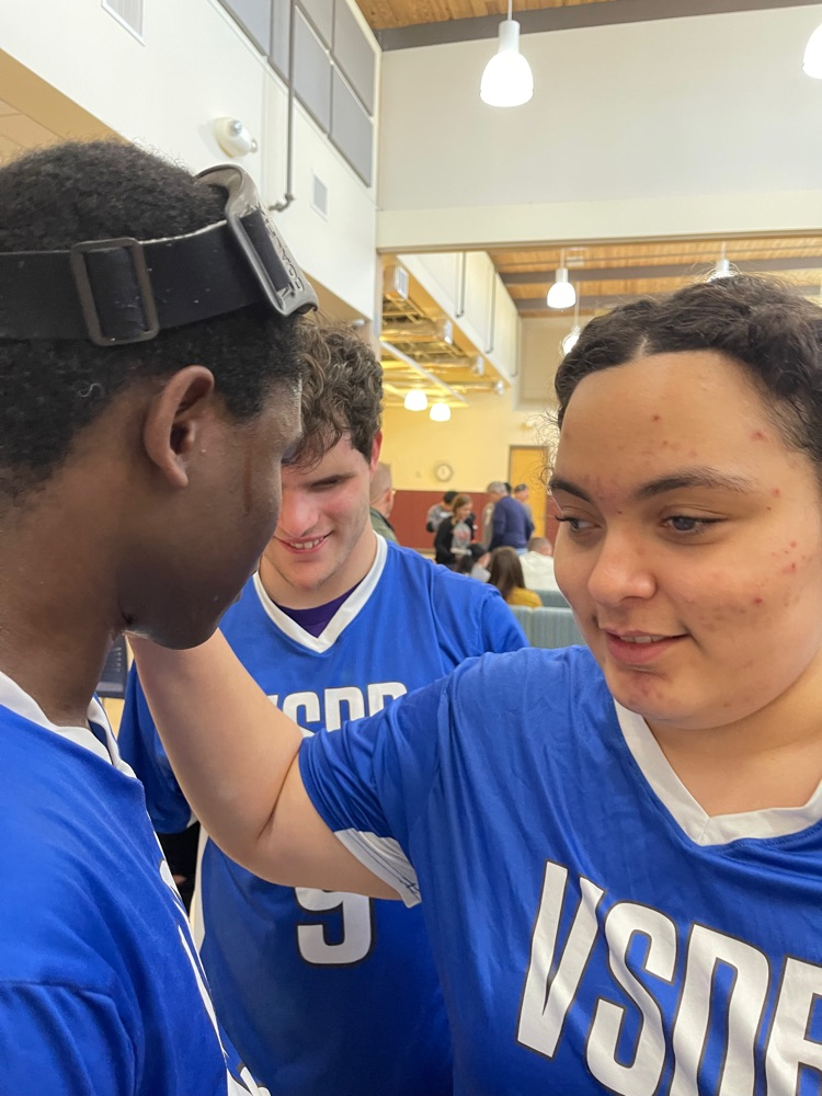 female player congratulating male player after his game